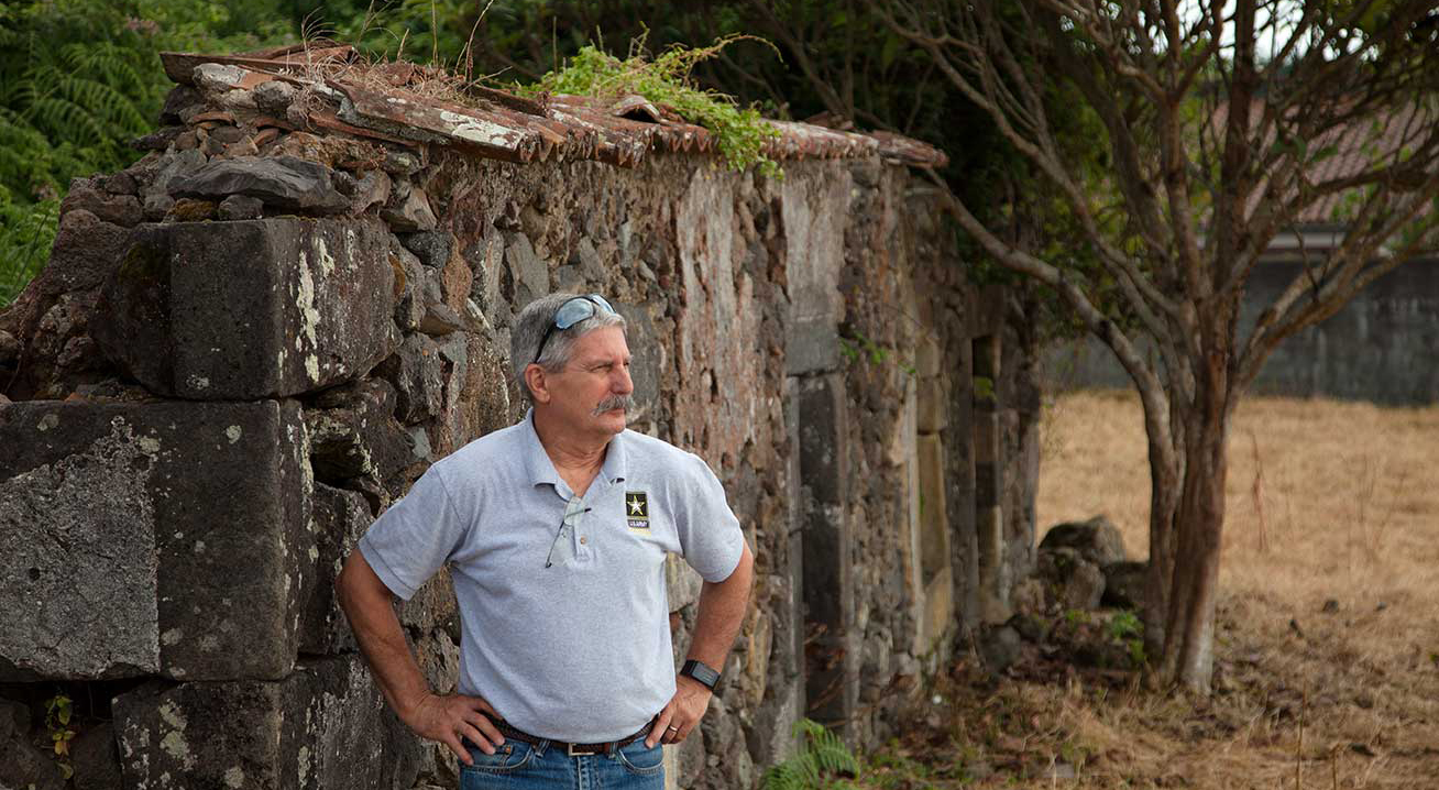 men with a grey shirt in the nature