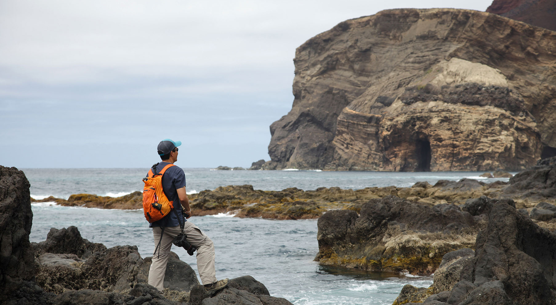 Our Faial full day tour will take us all around. Our island customer at Porto do Cumprido looking at Capelinhos Volcano